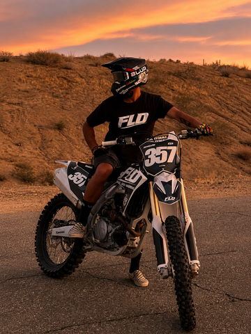 Motocross rider wearing FLD tees on graphics kit FLD