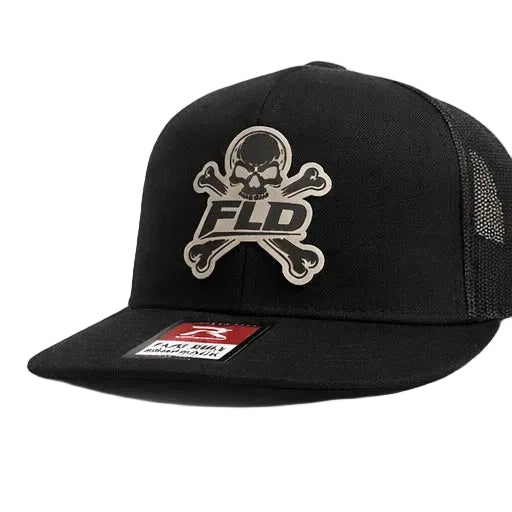 Black cap with skull and crossbones design and 'FLD' logo on a white background