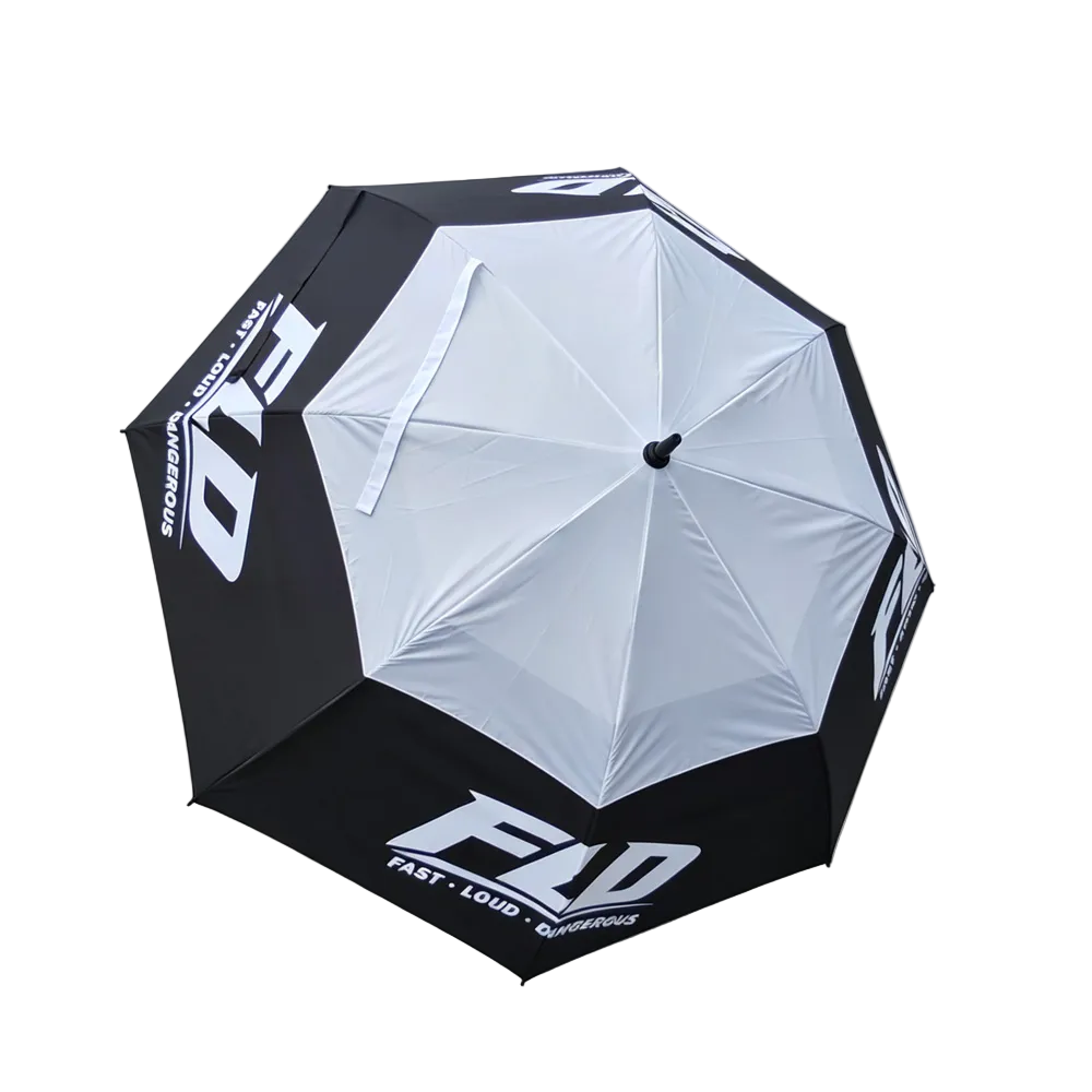 A black and white folding umbrella with bold white 'FBD' branding and 'FAST LOUD' text, shown open on a light gray background.